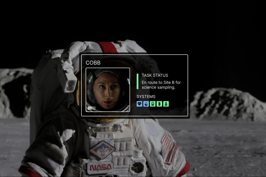 Full-format astronaut card overlayed on the helmet of an astronaut.